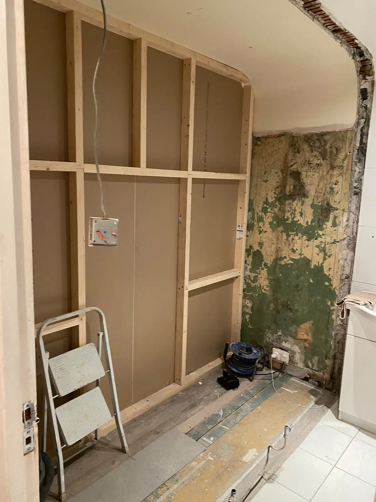 New stud wall framed out where the room was widened