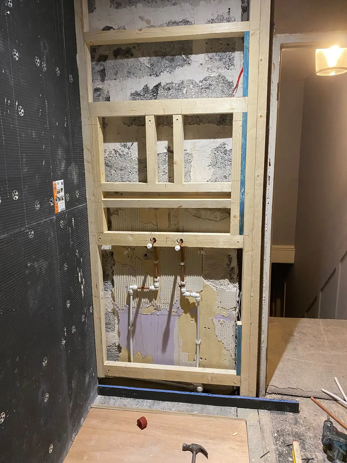 New pipework run inside a framed wall for the new layout