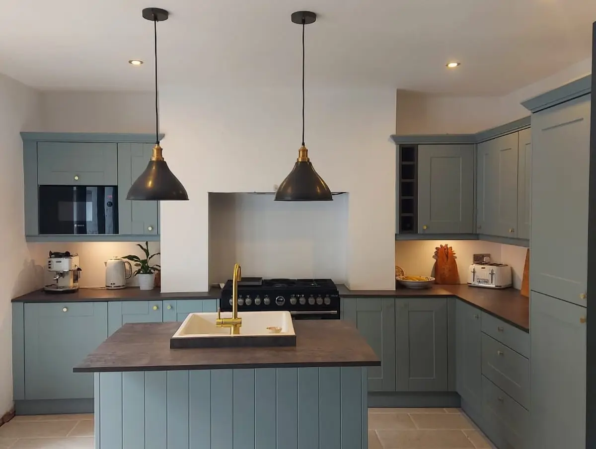 Blue-grey shaker kitchen with island and range cooker