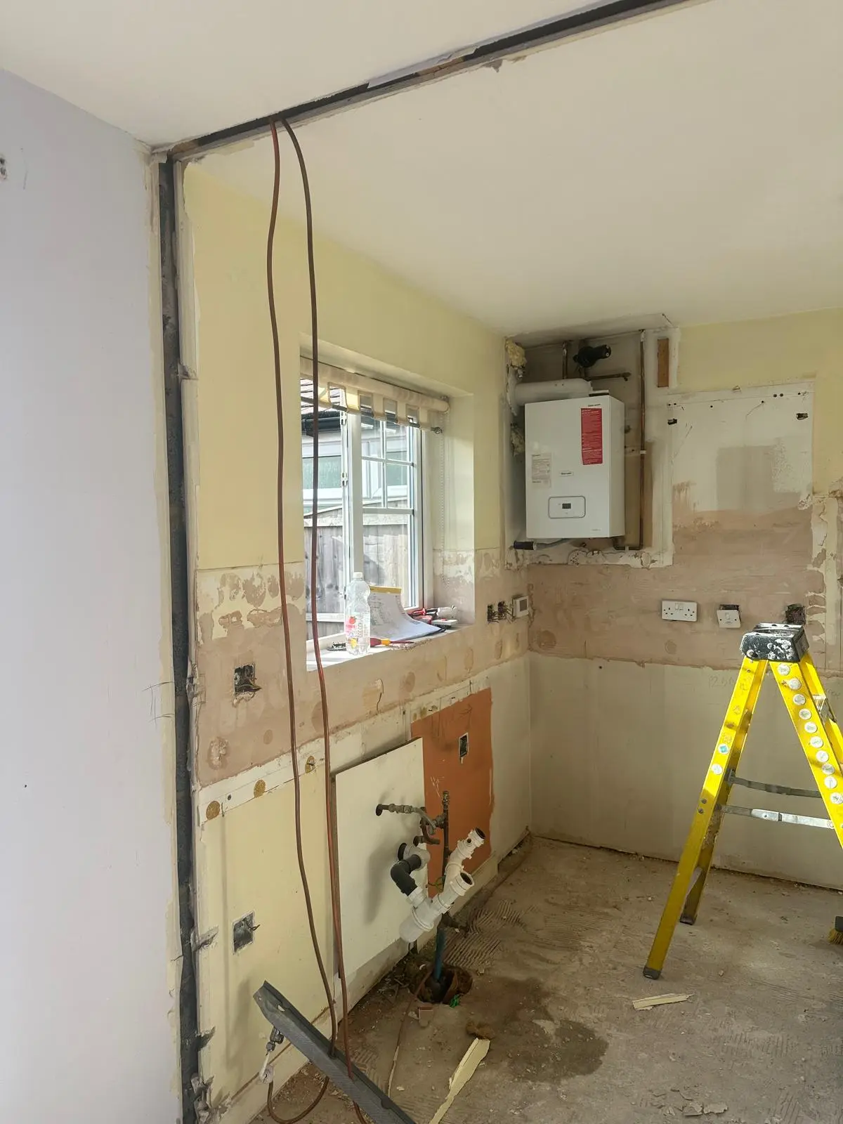 The new opening, looking through to the stripped-out kitchen