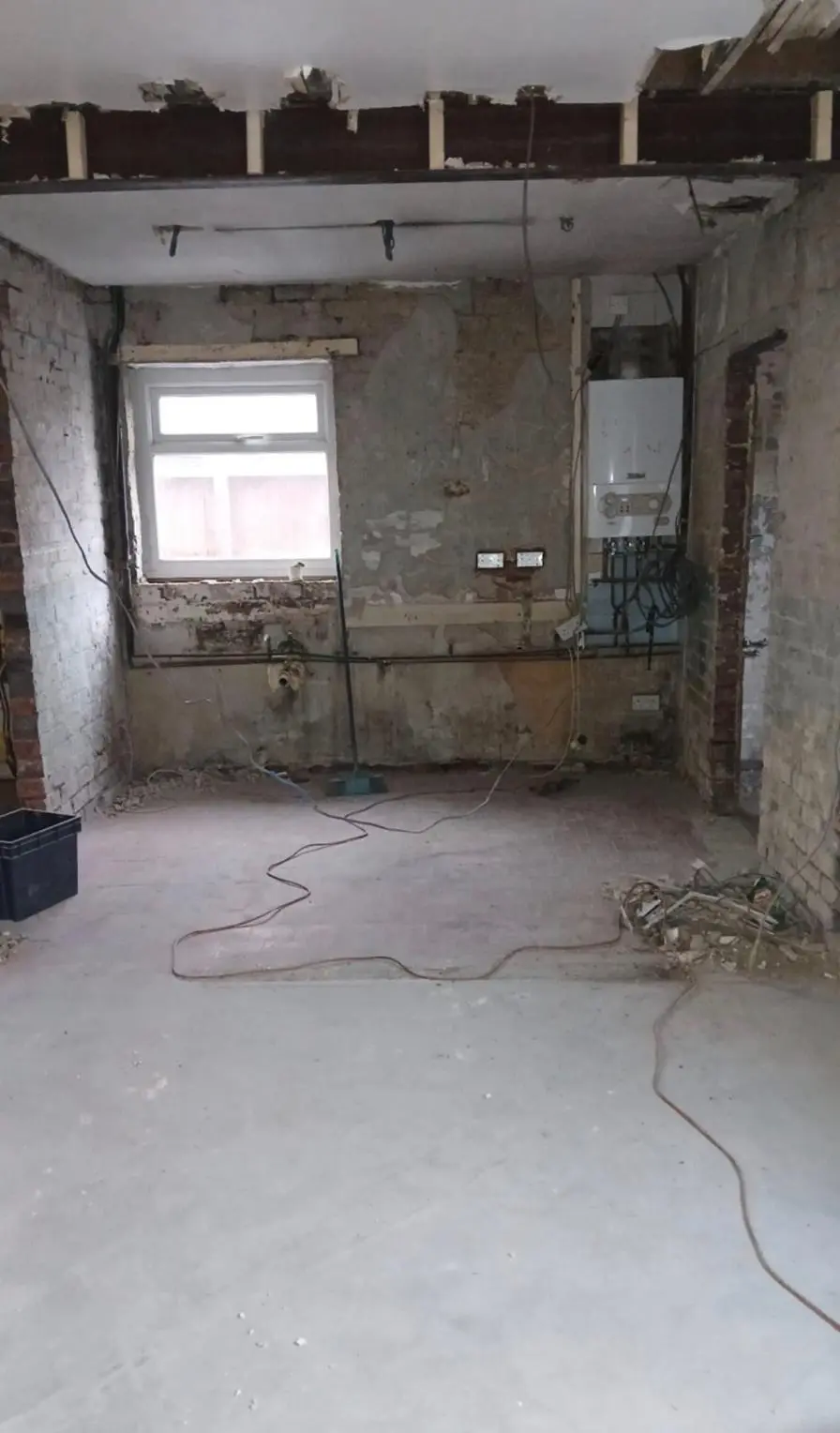 The two rooms opened into one and stripped back