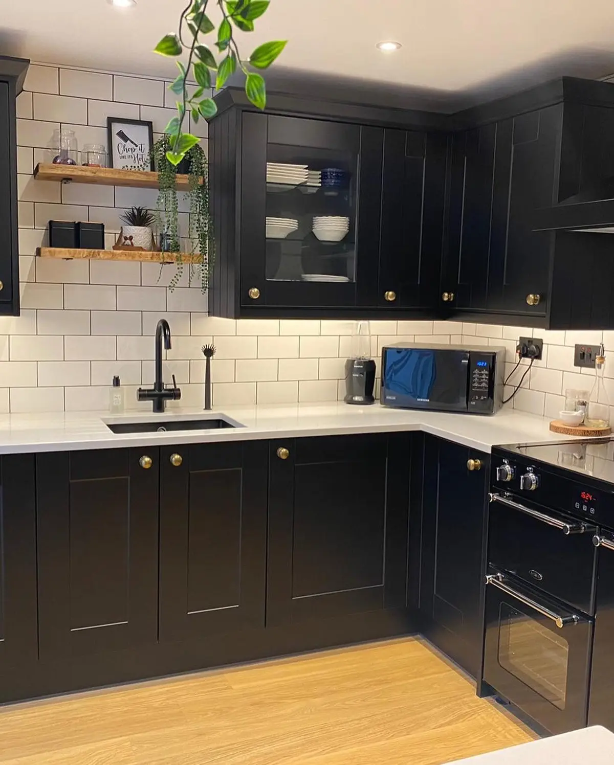 Matt black shaker sink run with white quartz worktop and open shelving