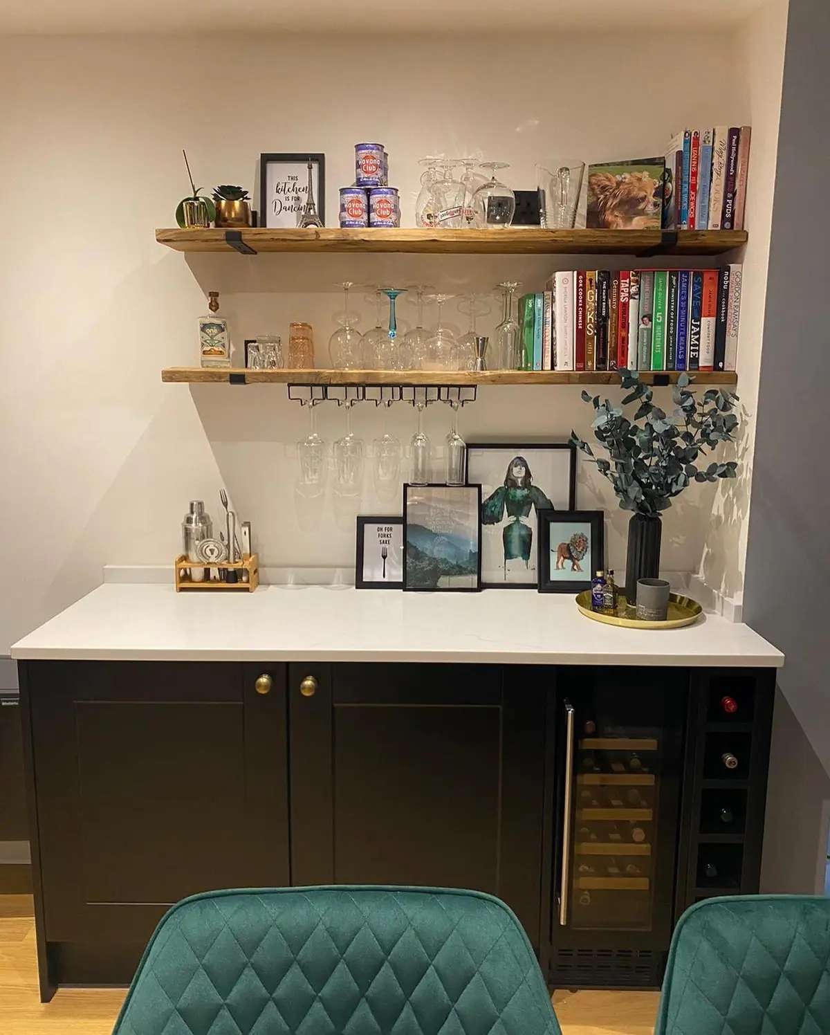 Matt black shaker dresser run with white worktop, integrated wine cooler and open shelving